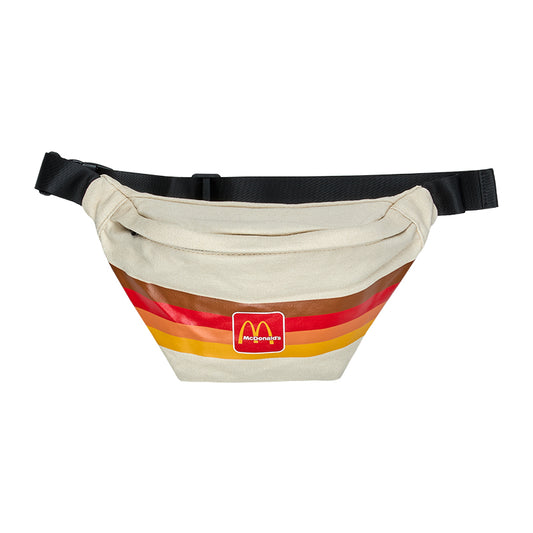 Beige bag with brown red and yellow stripes across the body with Golden Arches printed. 